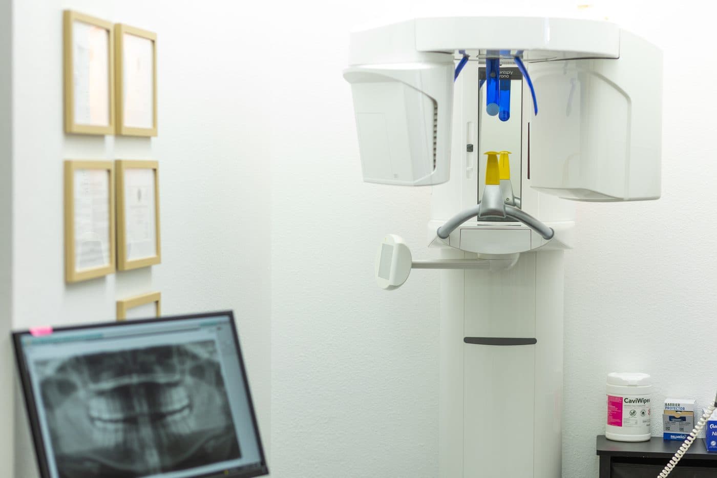 The 3D cone beam scanner in the Soleil Dental Mesquite office, with a panoramic x-ray on the monitor beside it