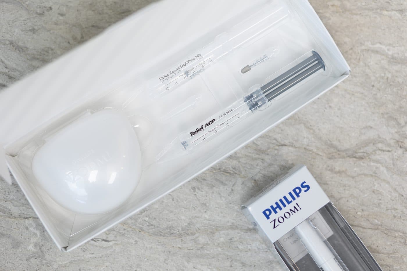 A Philips Zoom in-office whitening kit on a counter